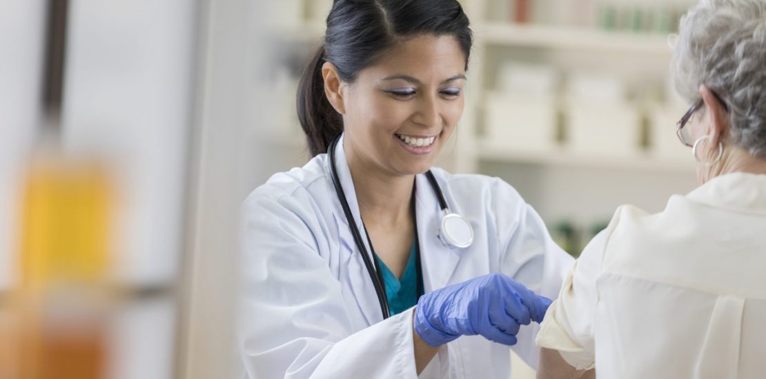 Nurse giving a patient a vaccination