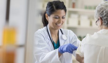 Nurse giving a patient a vaccination