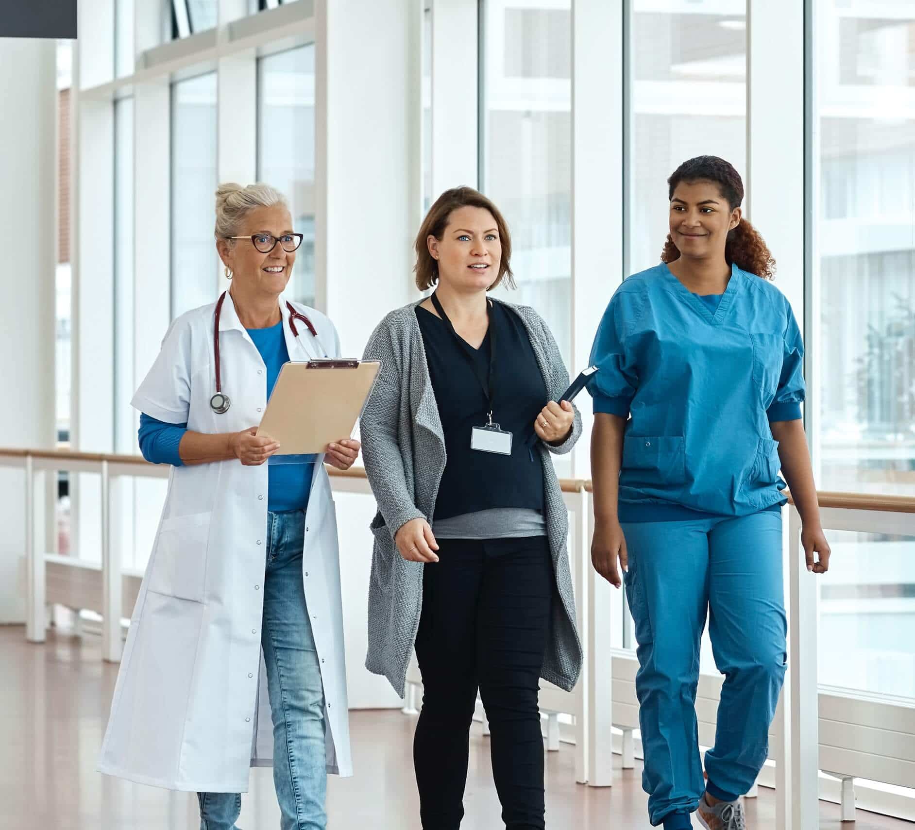 Doctors and nurses walking through a hospital