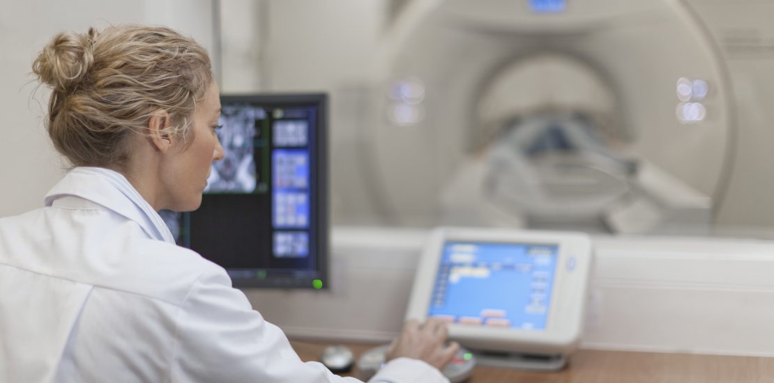 Allied health career radiologist looking at CT